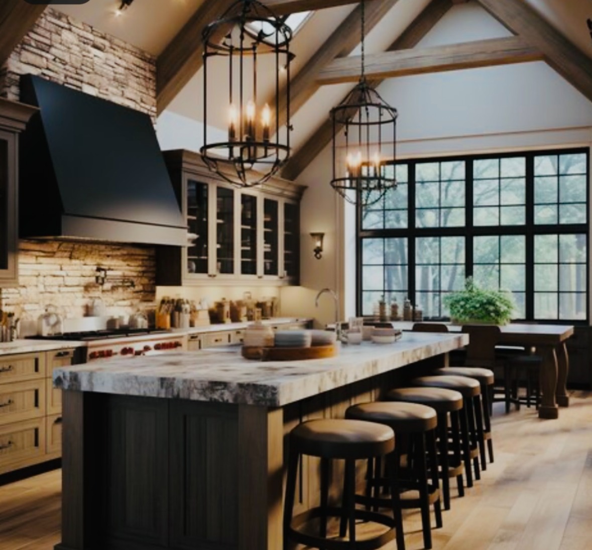 Rustic vaulted kitchen with stone hood and timber beams